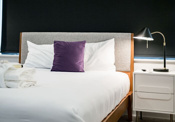 Cute bedside table and a small lamp