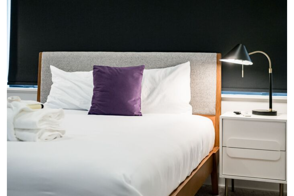 Cute bedside table and a small lamp